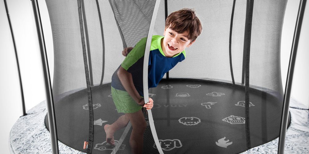 Boy exiting a Vuly trampoline safety net