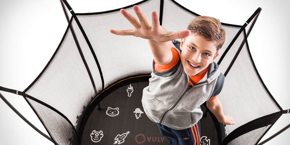 Boy bouncing high on a Vuly Thunder trampoline